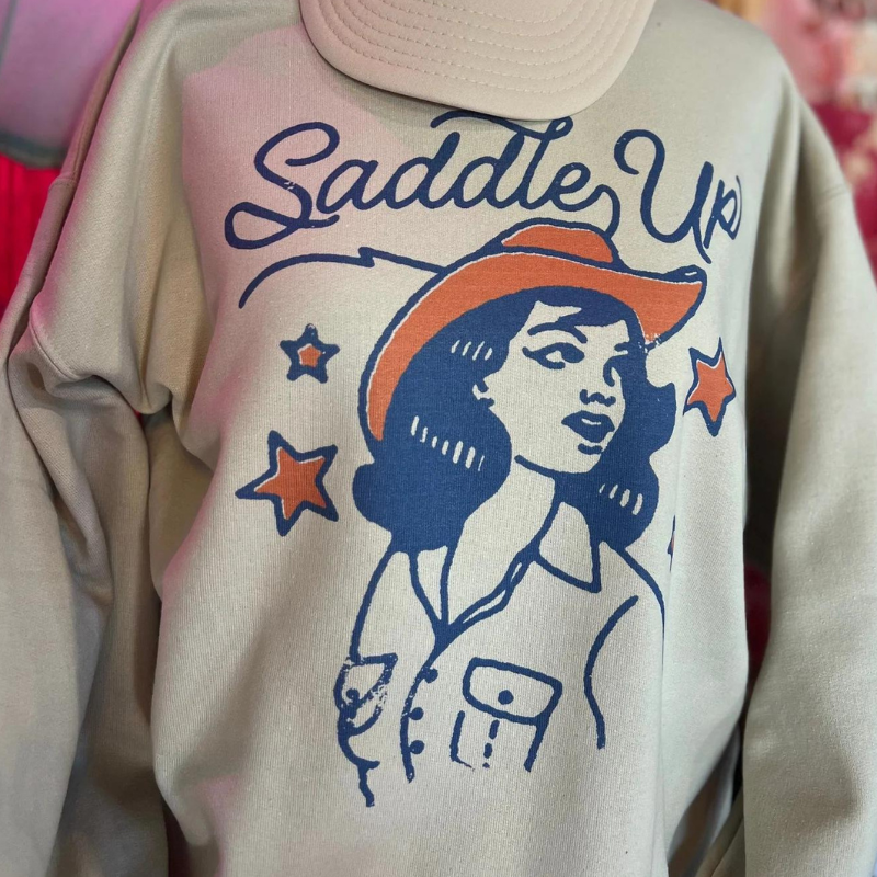 Online Exclusive | Saddle Up Cowgirl Long Sleeve Graphic Sweatshirt in Cream - Giddy Up Glamour Boutique