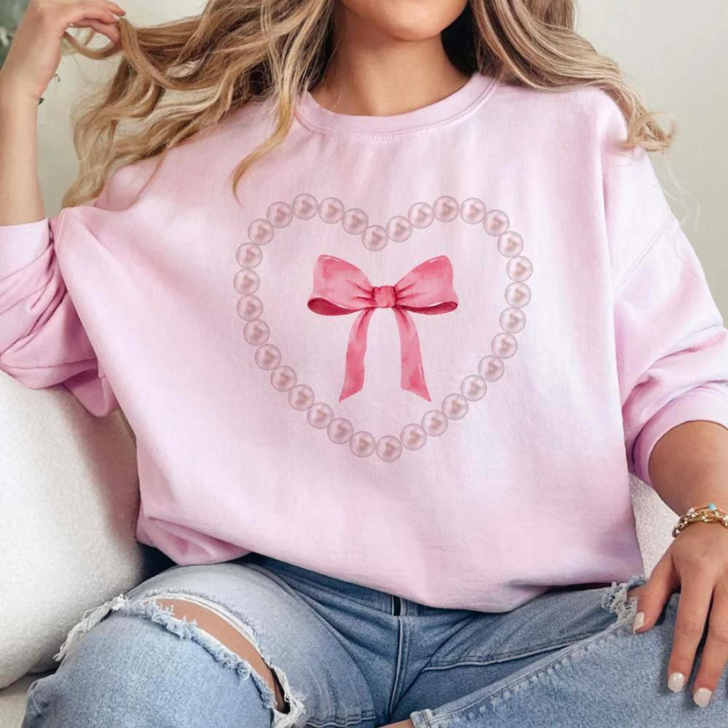 Online Exclusive | Pearl Heart Bow Coquette Long Sleeve Graphic Sweatshirt in Pink - Giddy Up Glamour Boutique