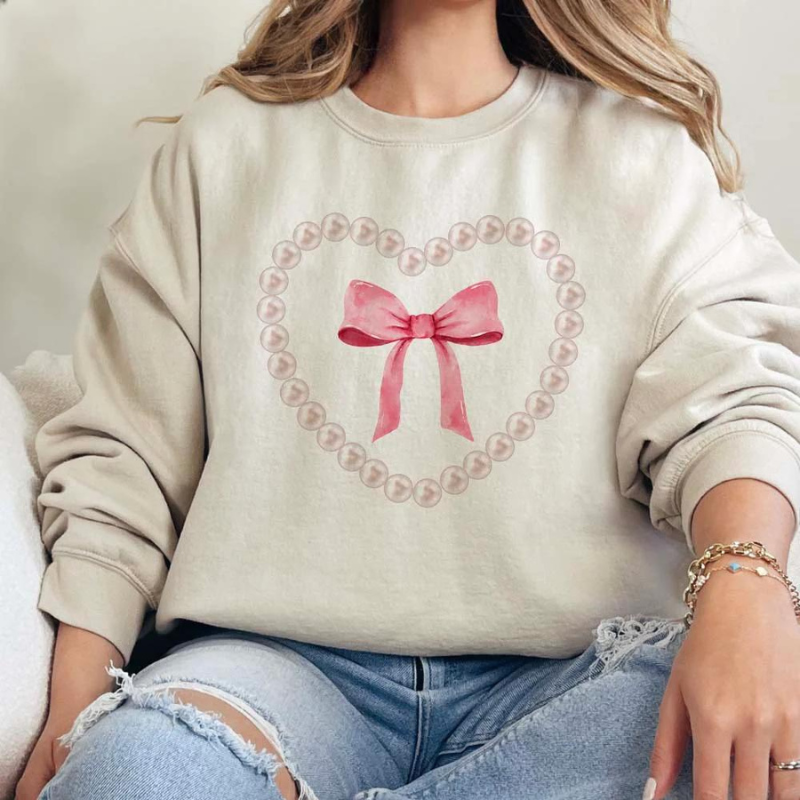 Online Exclusive | Pearl Heart Bow Coquette Long Sleeve Graphic Sweatshirt in Cream - Giddy Up Glamour Boutique