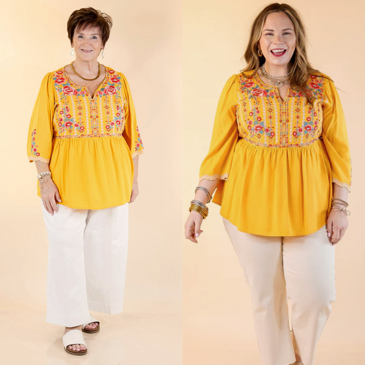 This top that features vibrant floral print embroidery. The top has 3/4 length sleeves and a v neckline. Available in sizes small through plus size. 