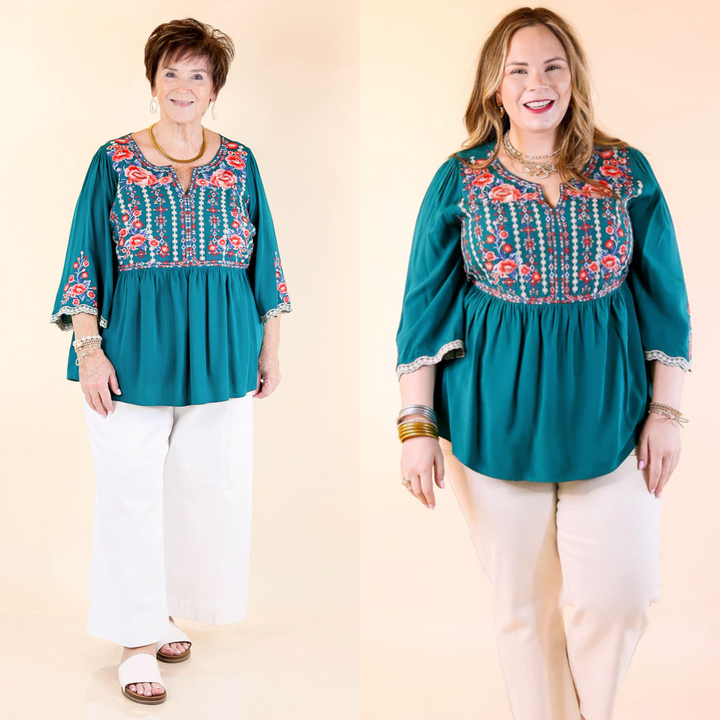 This top features vibrant floral print embroidery. The top has 3/4 length sleeves and a v neckline. Available in sizes small through plus size. 