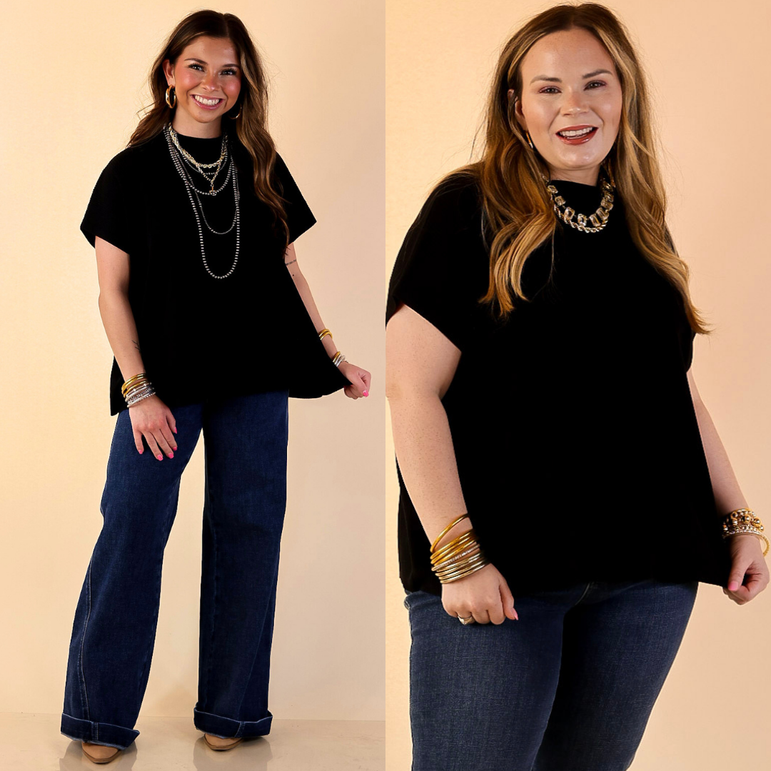 Models are wearing Short Sleeve Mock Neck Top in Back with Jeans against a beige beackdrop.