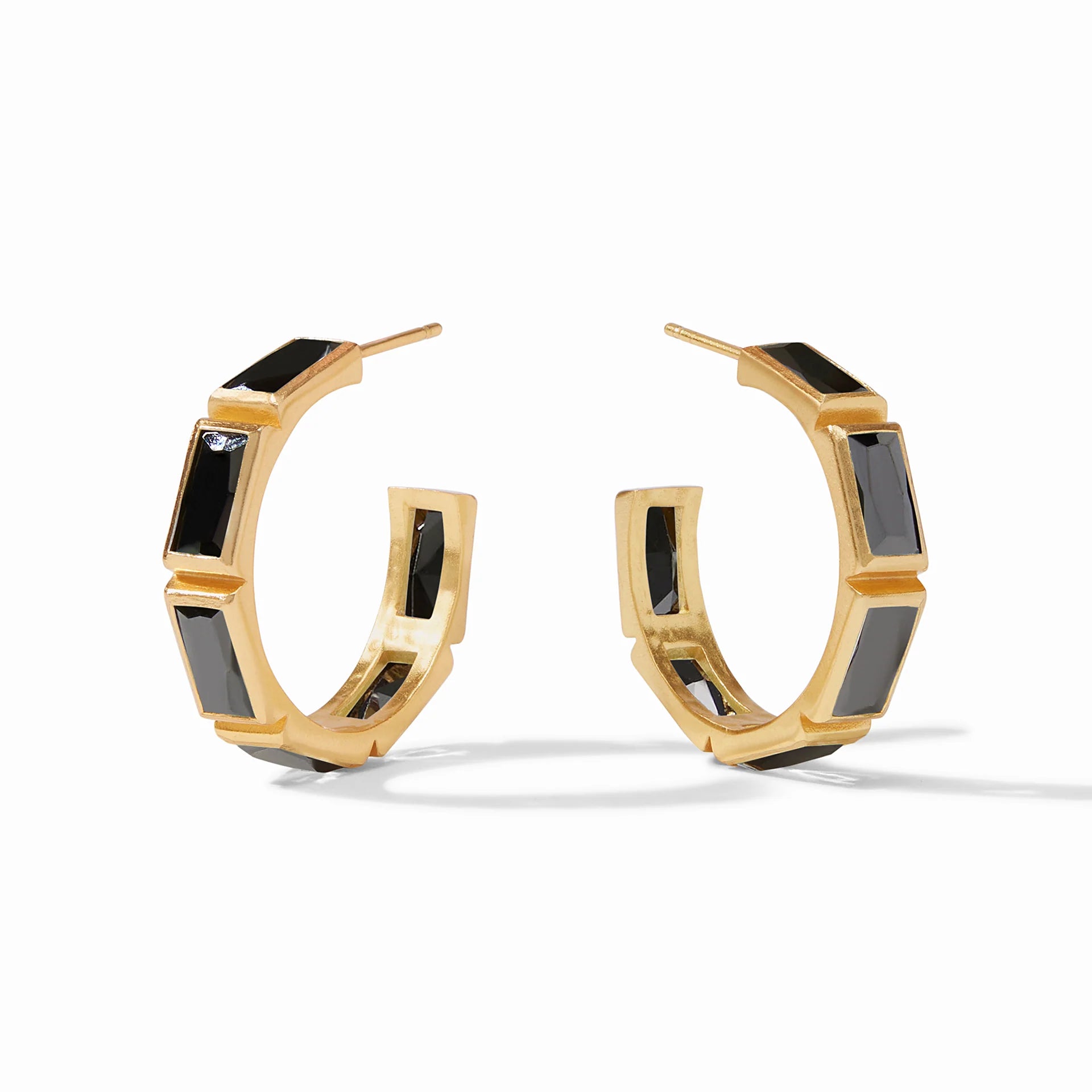 Gold hoop earrings with black, rectangle crystals pictured on a white background.