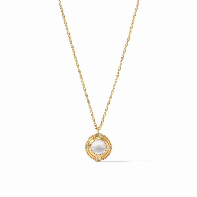 Pictured is a gold chain necklace with gold and clear crystal pendant pictured on a white background. 