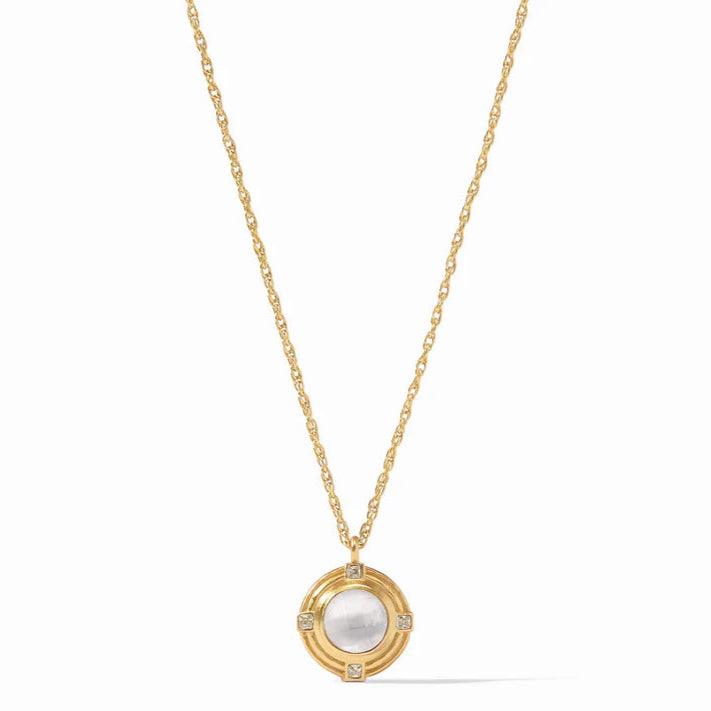 Pictured is a gold chain necklace with gold and clear crystal pendant pictured on a white background. 