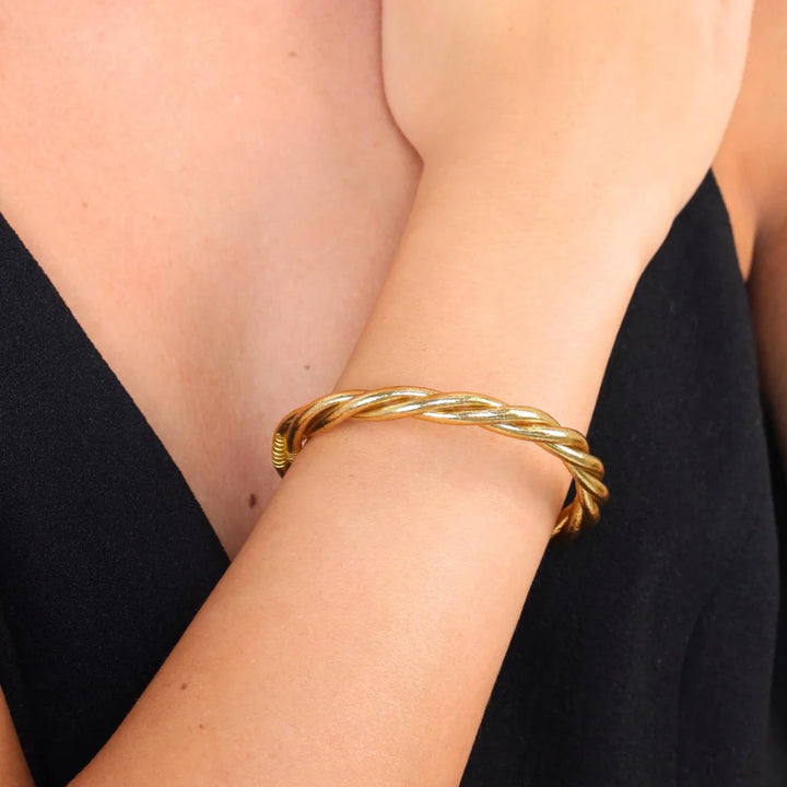 BuDhaGirl | Twist All Weather Bangle in Aura Gold