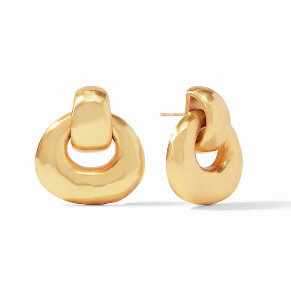 Pictured is a pair of gold doorknocker earrings on a white background. 
