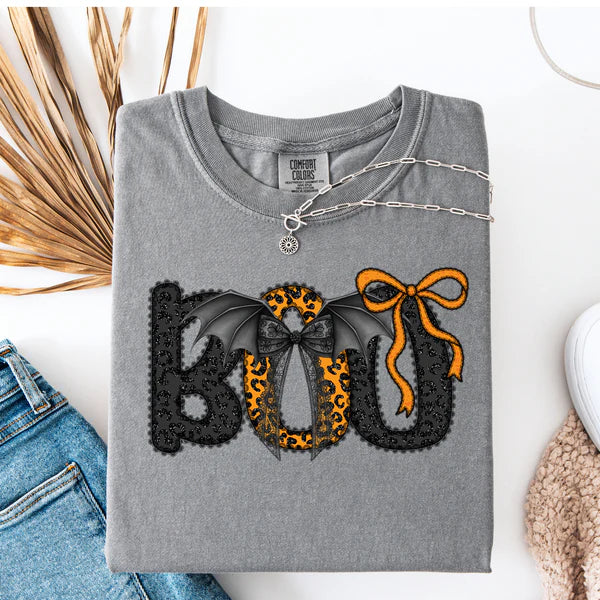 Gray sweatshirt with Halloween-themed design on a white surface