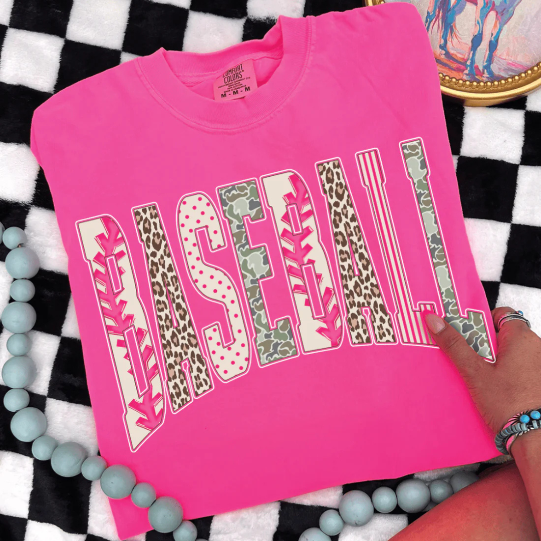 Comfort Colors graphic t-shirt featuring a bold BASEBALL design with mixed prints including baseball stitching, leopard, polka dots, stripes, and camo.