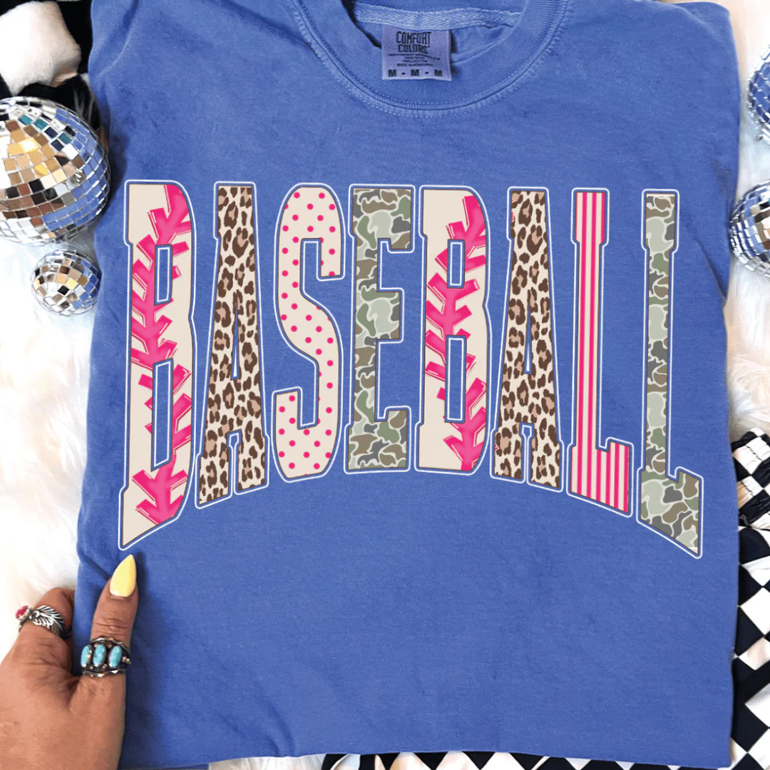 Comfort Colors graphic t-shirt featuring a bold BASEBALL design with mixed prints including baseball stitching, leopard, polka dots, stripes, and camo.