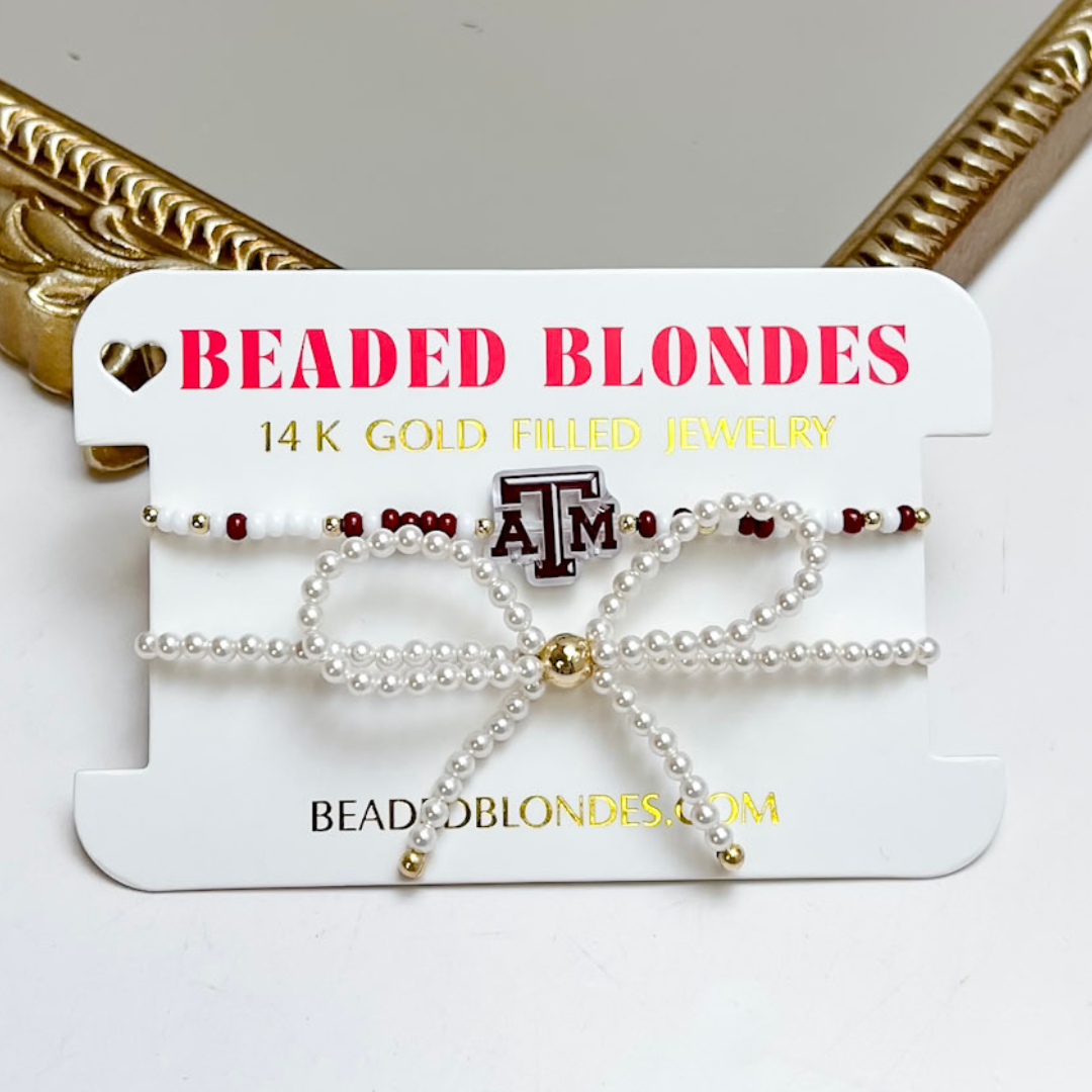 Two-piece bracelet stack featuring a maroon and white A&amp;M logo bracelet and a pearl bow bracelet with gold accents.