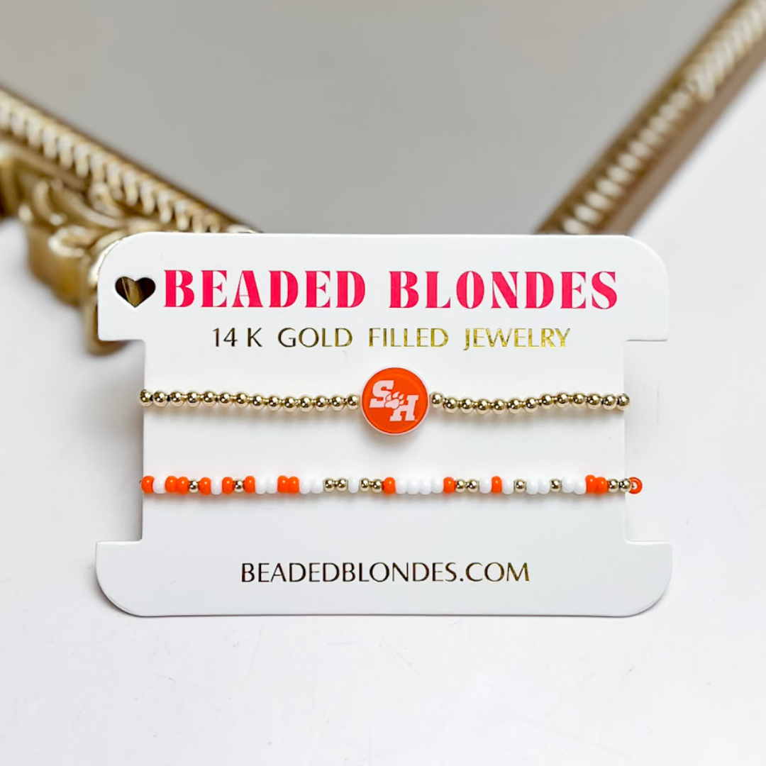 Gold and orange beaded bracelet on a &