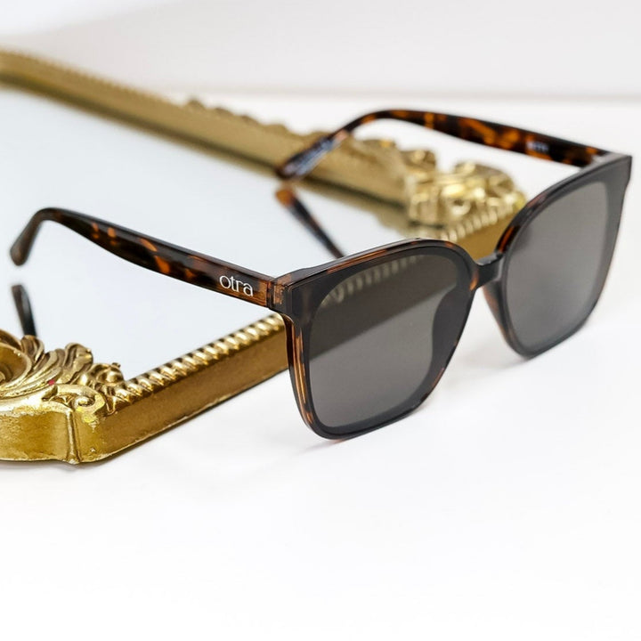 Sunglasses with Tortoiseshell frame on a white background