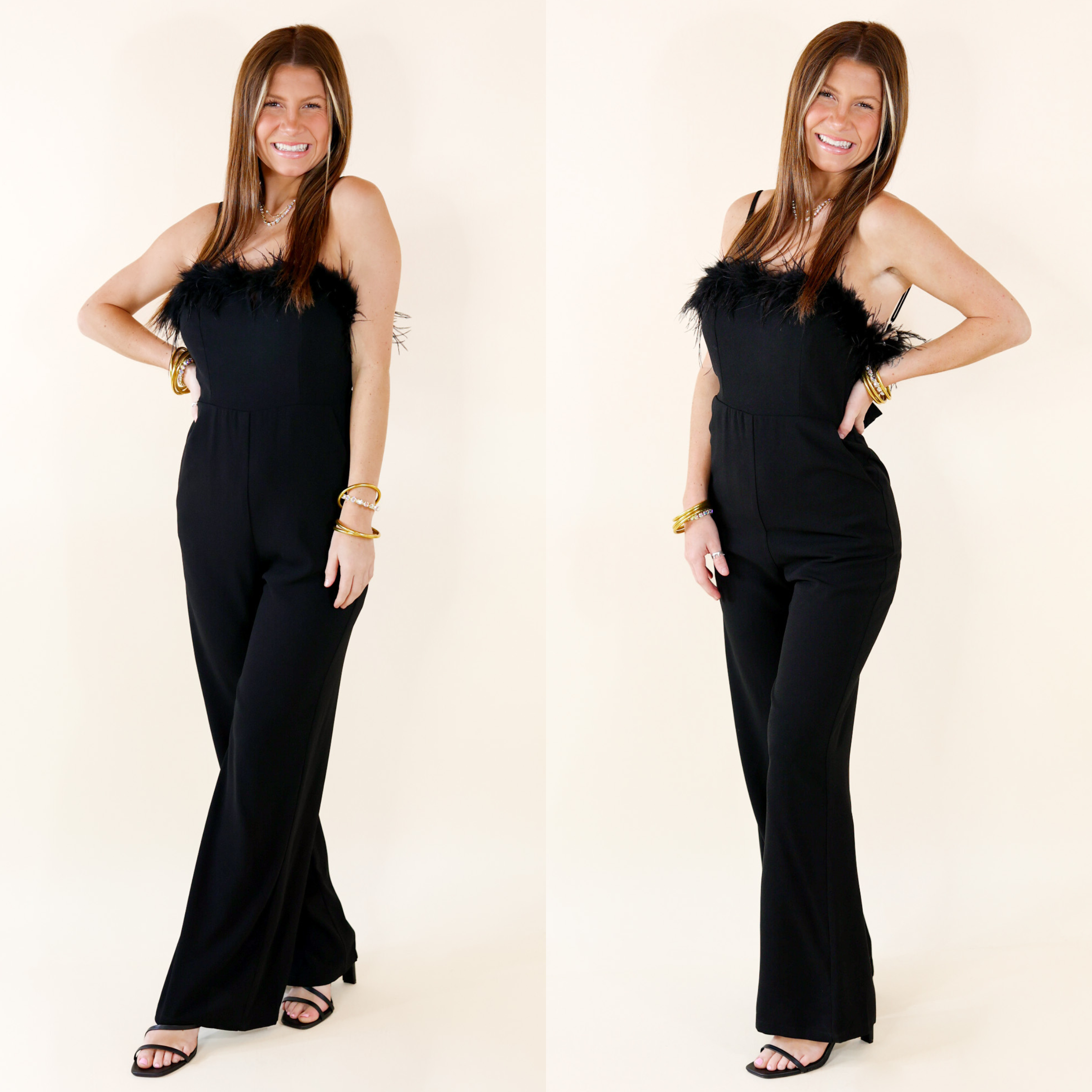 Black Jumpsuit with spaghetti straps. The jumper has feathers along the top of it. The model is wearing black heels and gold jewelry. 