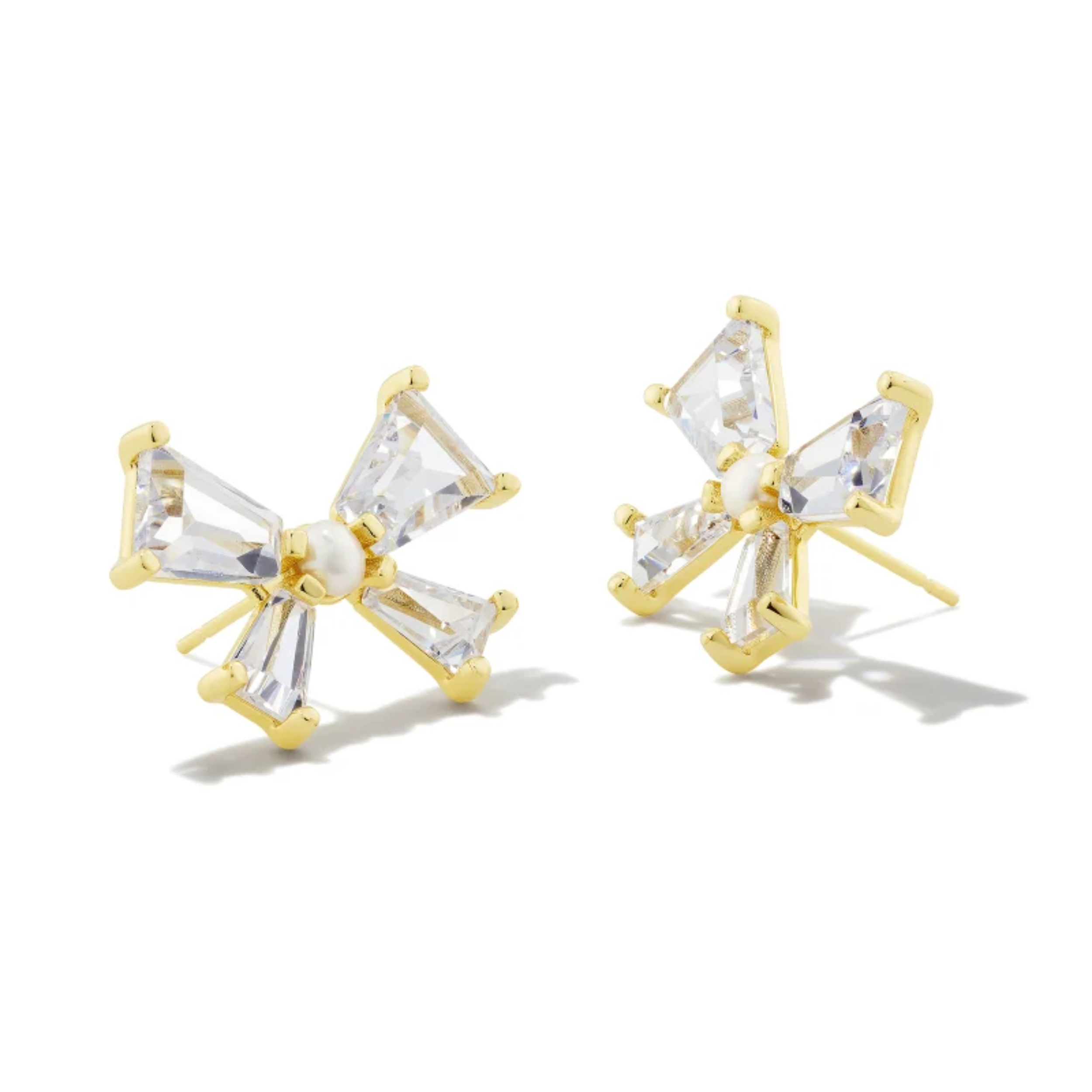 These Blair Bow Stud Earrings In Gold White by Kendra Scott is pictured on a white background.