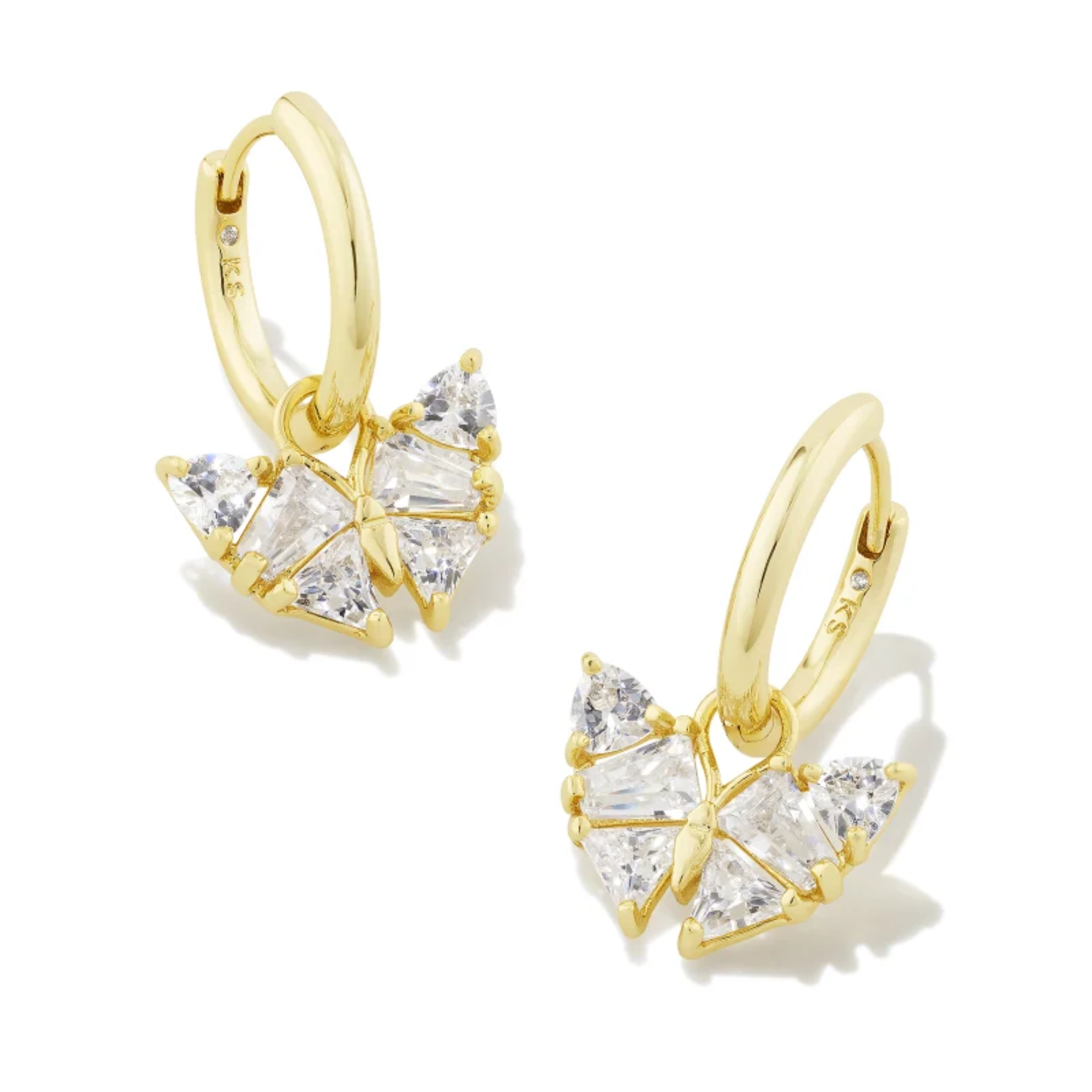 These Blair Gold Butterfly Huggie Earrings in White Crystal by Kendra Scott are pictured on a white background.