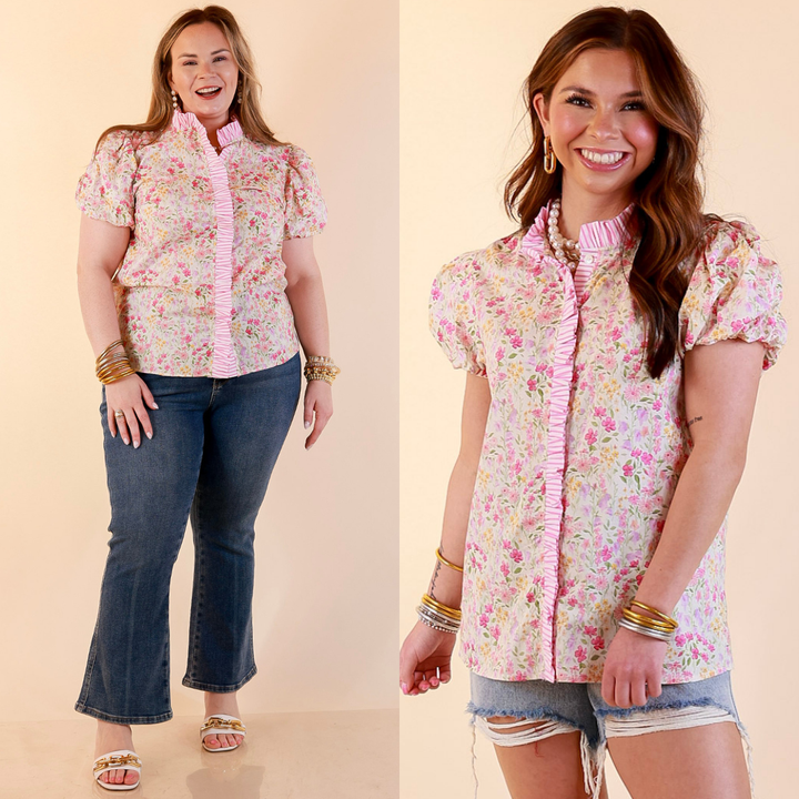 Models are wearing Short Puff Sleeve Ruffle Trim Button Front Floral Peplum Top in Pink with bottoms against a beige backdrop. 