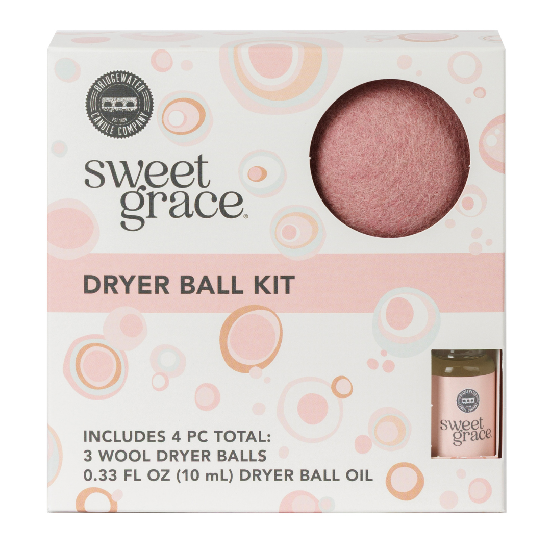 Sweet Grace dryer ball kit packaging with dryer balls and oil on a white background