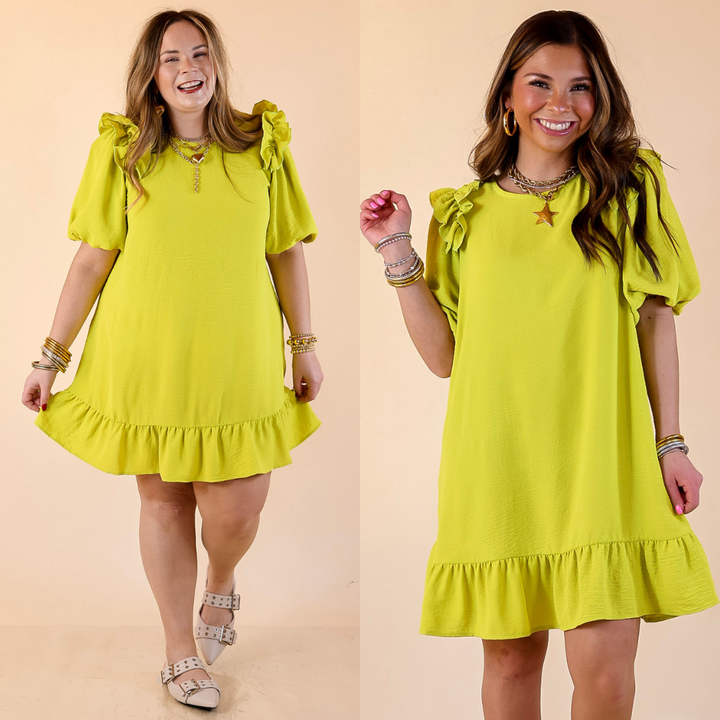 Two women wearing chartreuse green dress with ruffle sleeve against a beige background