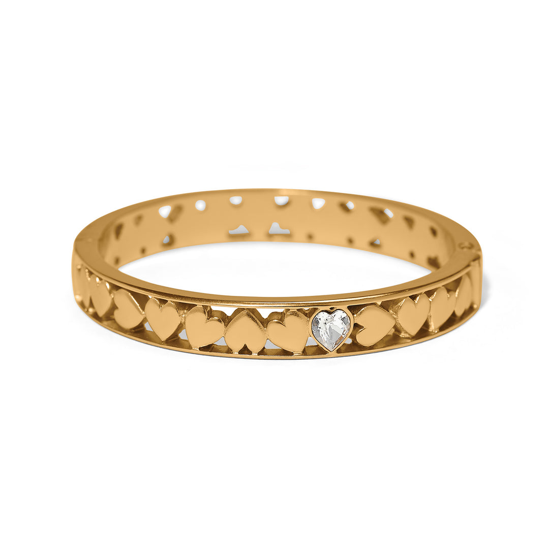Gold bracelet with heart designs on a white background
