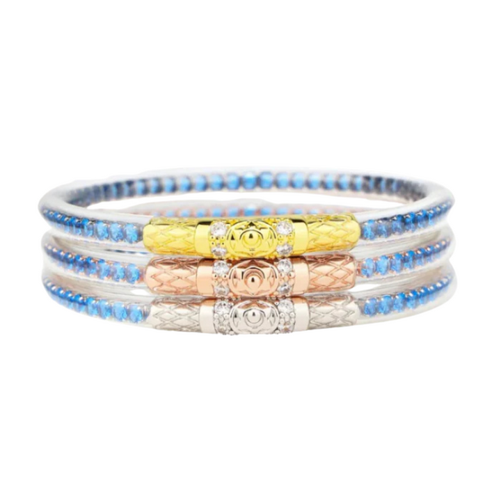 Set of three beaded bracelets with colorful beads on a white background