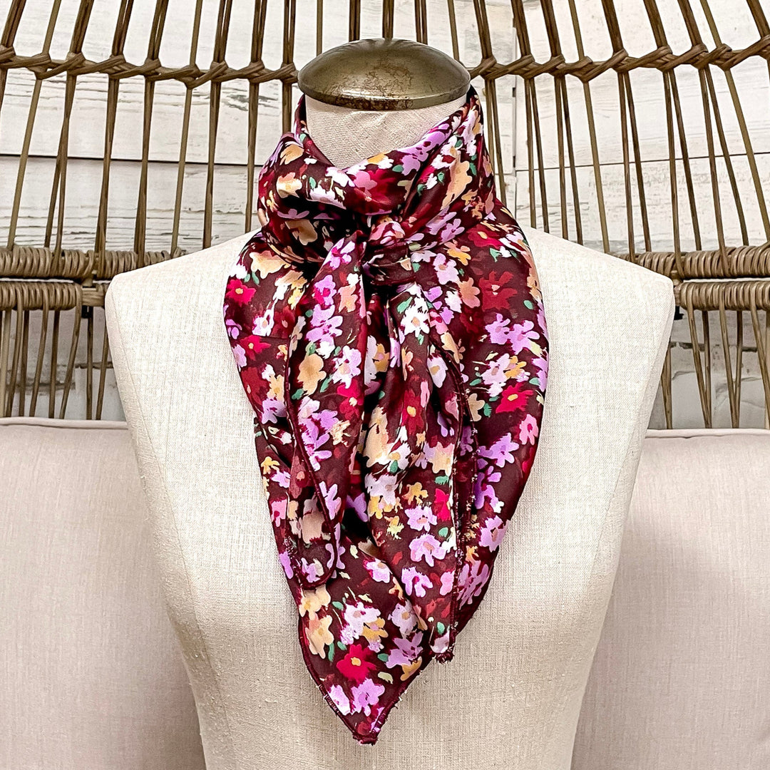 Mannequin wearing a floral scarf in a wicker chair