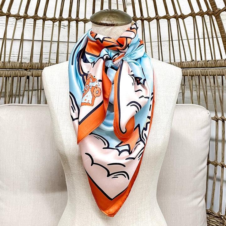 Colorful scarf on a mannequin head against a wicker chair background