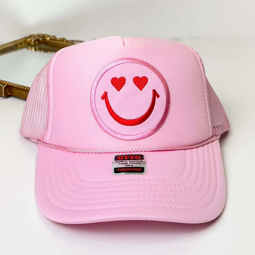Heart Eyes Happy Face Foam Trucker Hat in Light Pink - Giddy Up Glamour Boutique