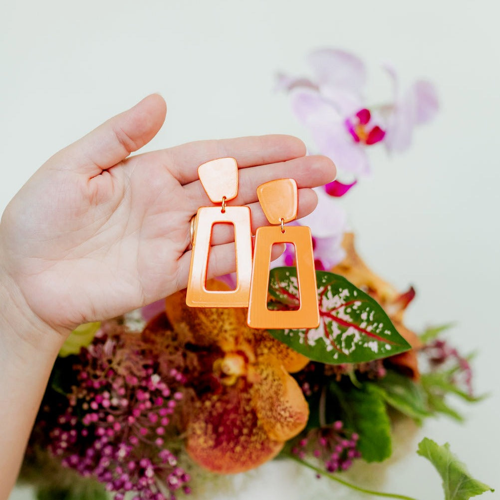 Linny Co | Kennedy Rectangular Drop Earrings in Metallic Orange