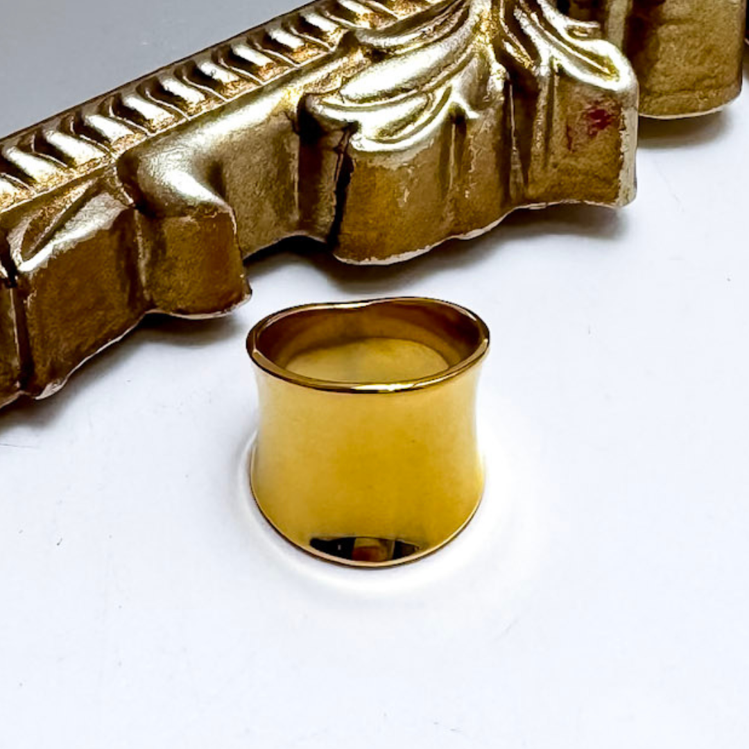 Gold ring on a white background