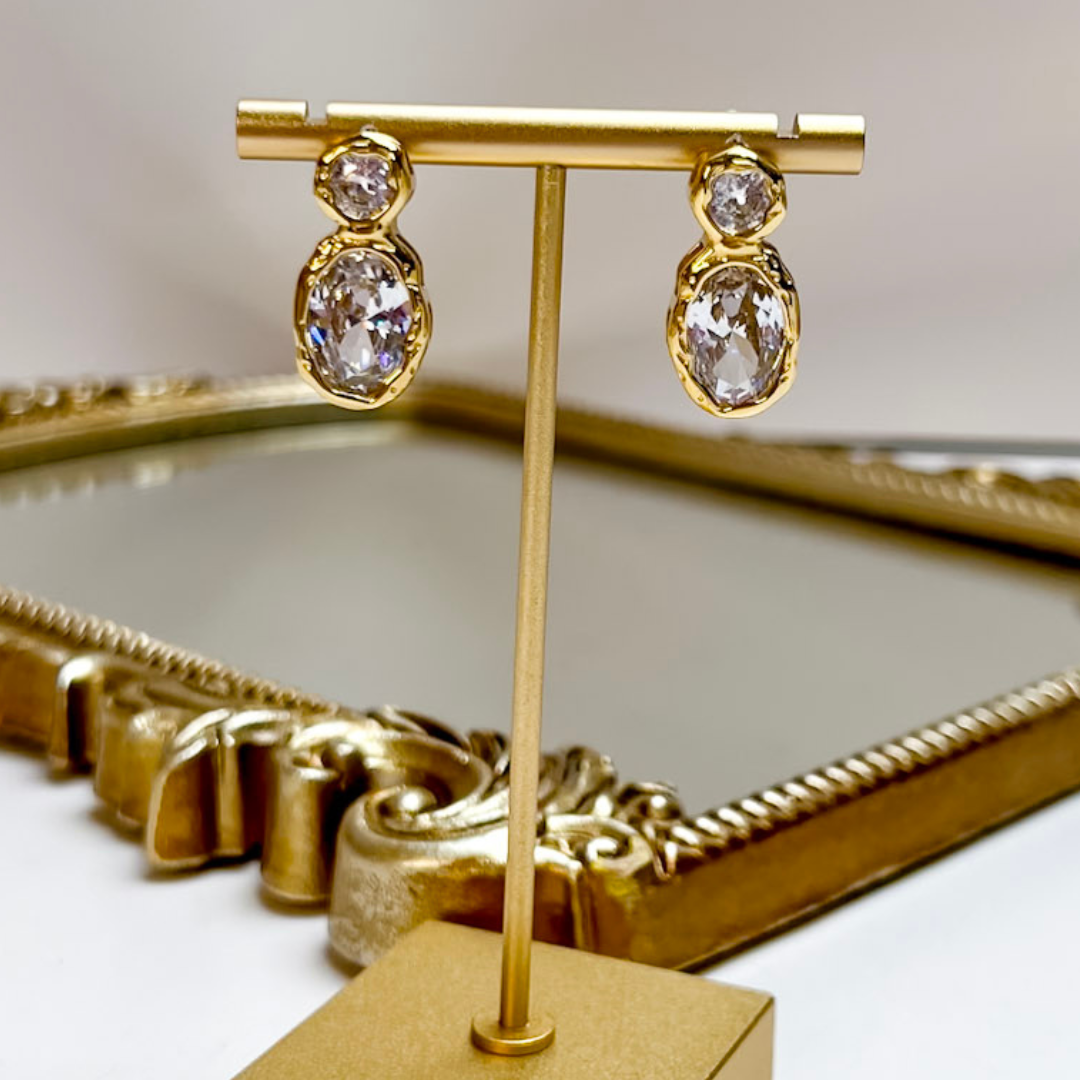 Chan Sutt Pearls Serenity Double Stone Crystal Drop Earrings in Gold featuring round and oval bezel-set clear crystals with a polished gold-tone finish.