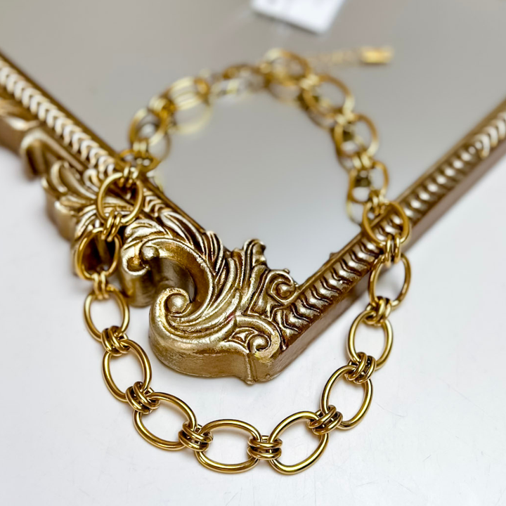 CHANSUTT PEARLS The Luxe Chain Necklace in Gold featuring oversized oval open links connected by wrapped double-ring details.