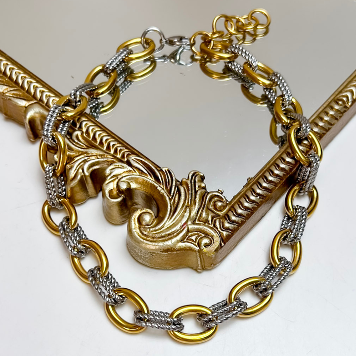 CHANSUTT PEARLS The Margo Two-Tone Chain Necklace featuring polished gold oval links connected by textured silver-tone multi-strand links.