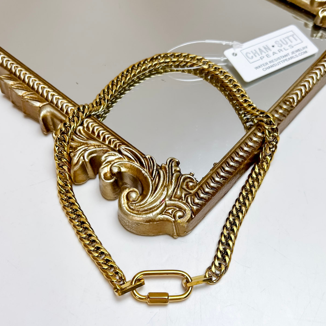 Chan Sutt Pearls The Stephanie Chain Necklace in Gold featuring a polished gold-tone curb chain with a modern oval connector clasp detail.