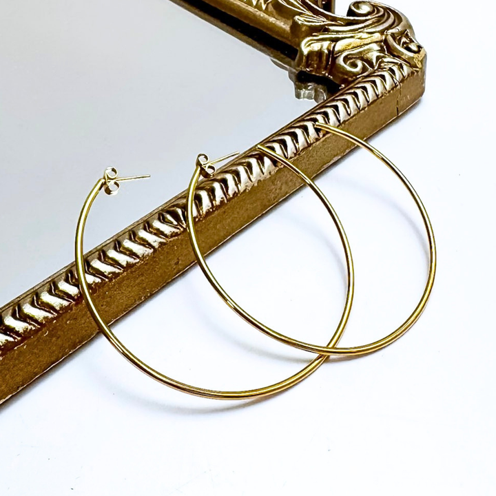 CHANSUTT PEARLS | Thin Large Hoop Earrings in Gold
