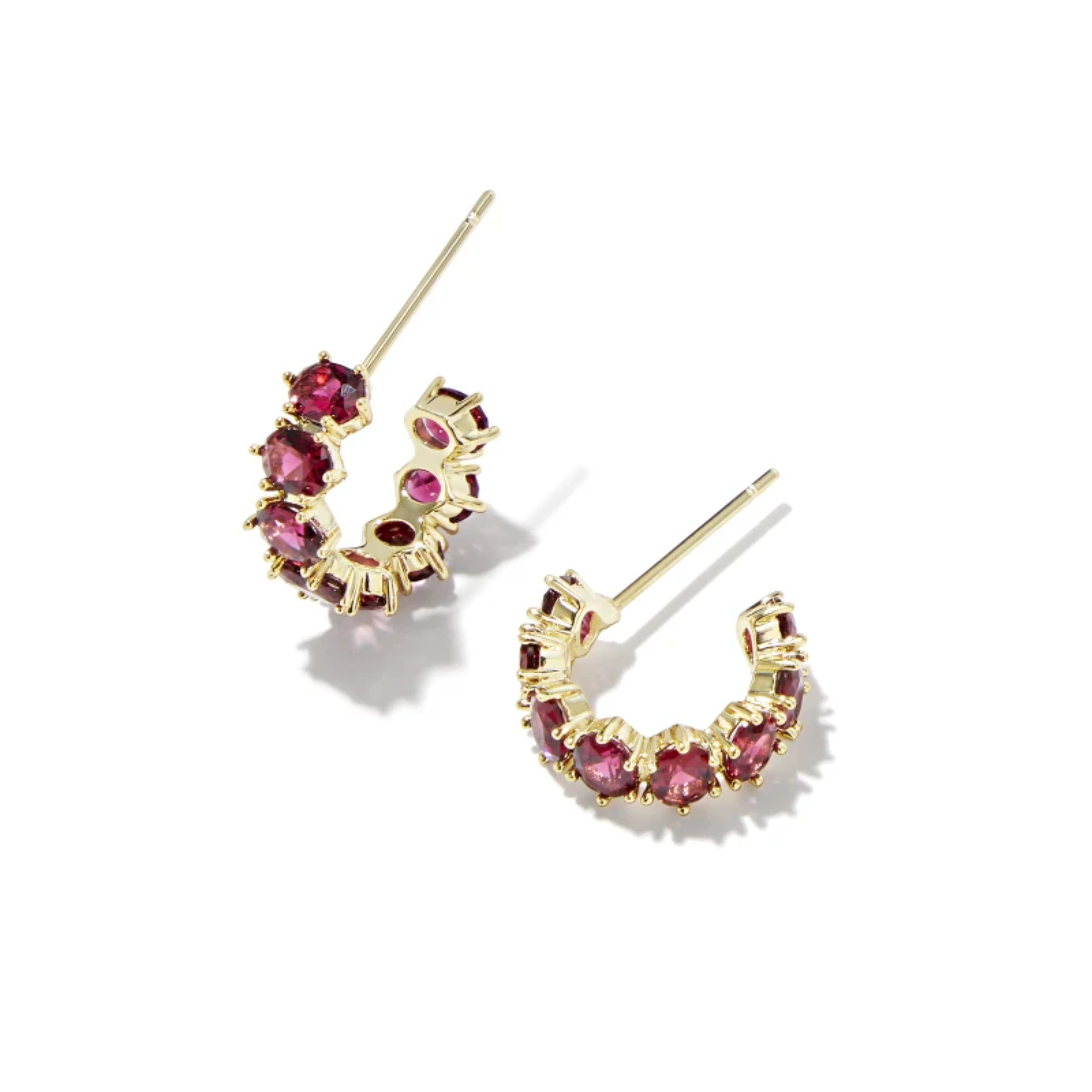 These Cailin Gold Crystal Huggie Earrings in Burgundy Crystal by Kendra Scott are pictured on a white background.