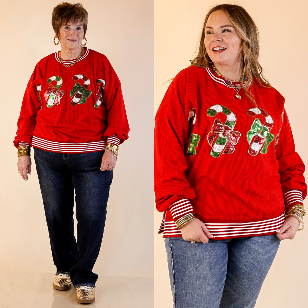 Models are wearing red Christmas sweatshirts with sequined candy cane designs on a beige background.