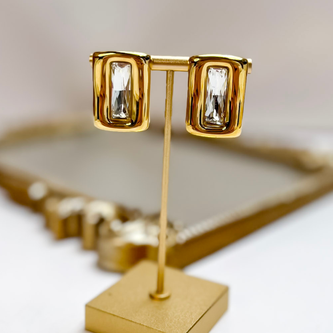 Chan Sutt Pearls Brooke Rectangle Crystal Earrings in Gold featuring rectangular clear crystals set in polished gold-tone stud earrings.