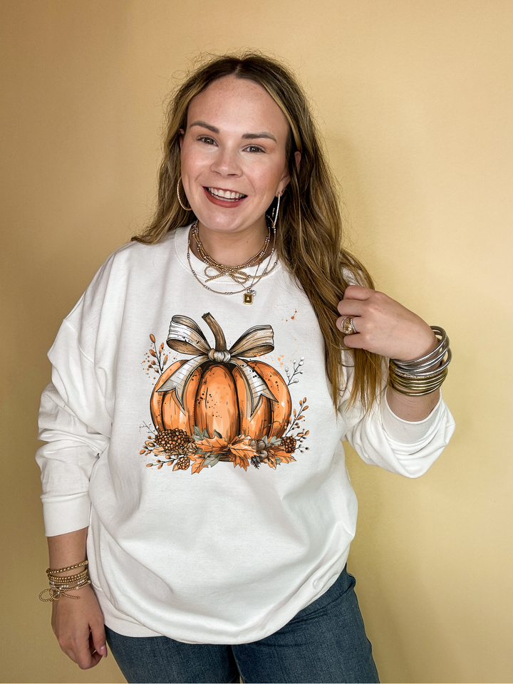Online Exclusive | Chic Autumn Pumpkin on a Bed of Leaves with Off White Bow Graphic Sweatshirt in Multiple Color Options