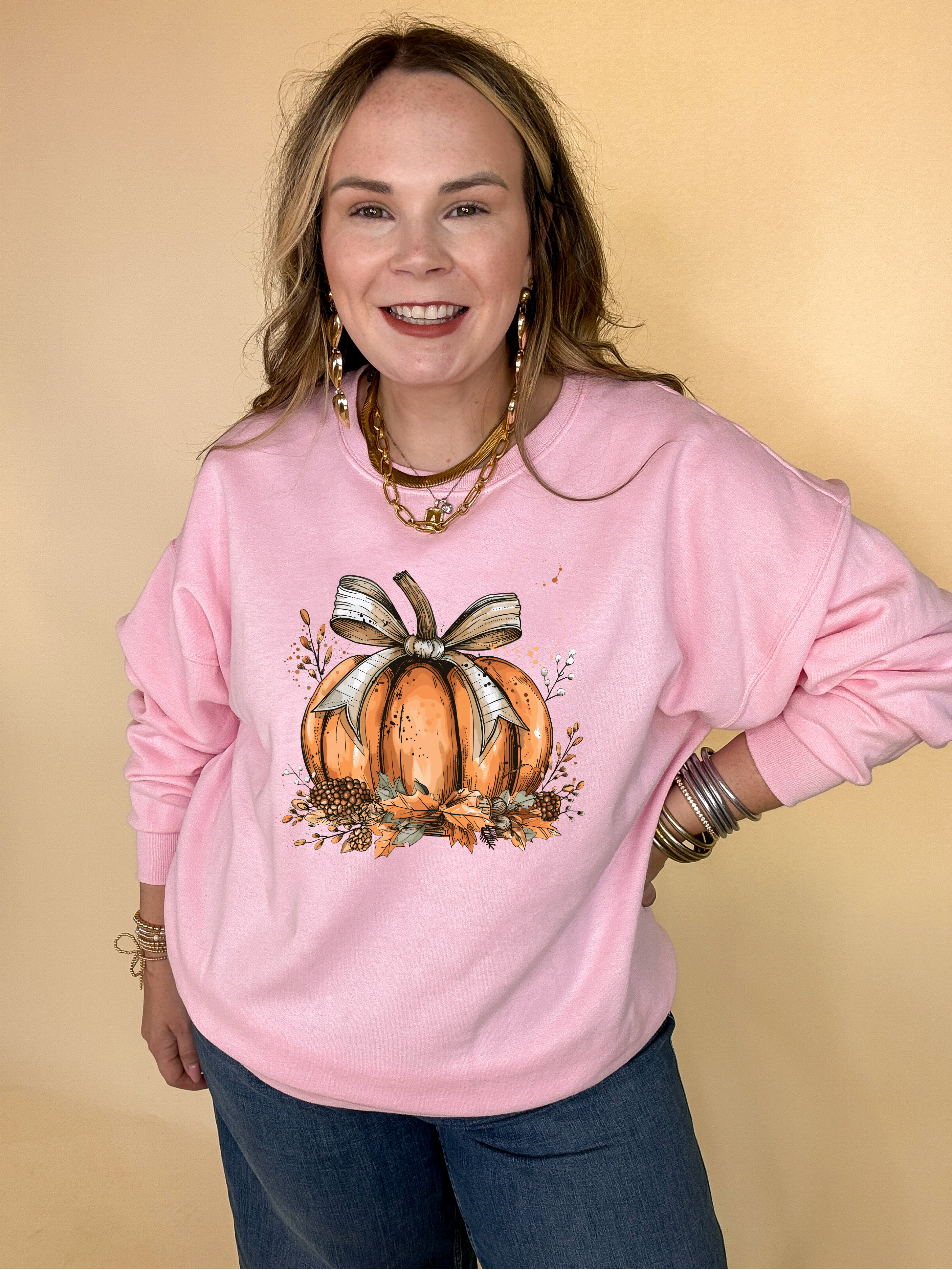 Online Exclusive | Chic Autumn Pumpkin on a Bed of Leaves with Off White Bow Graphic Sweatshirt in Multiple Color Options