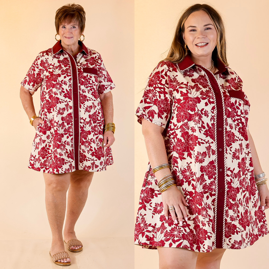 Two women wearing a maroon collard button up dress with floral detailing on a beige background