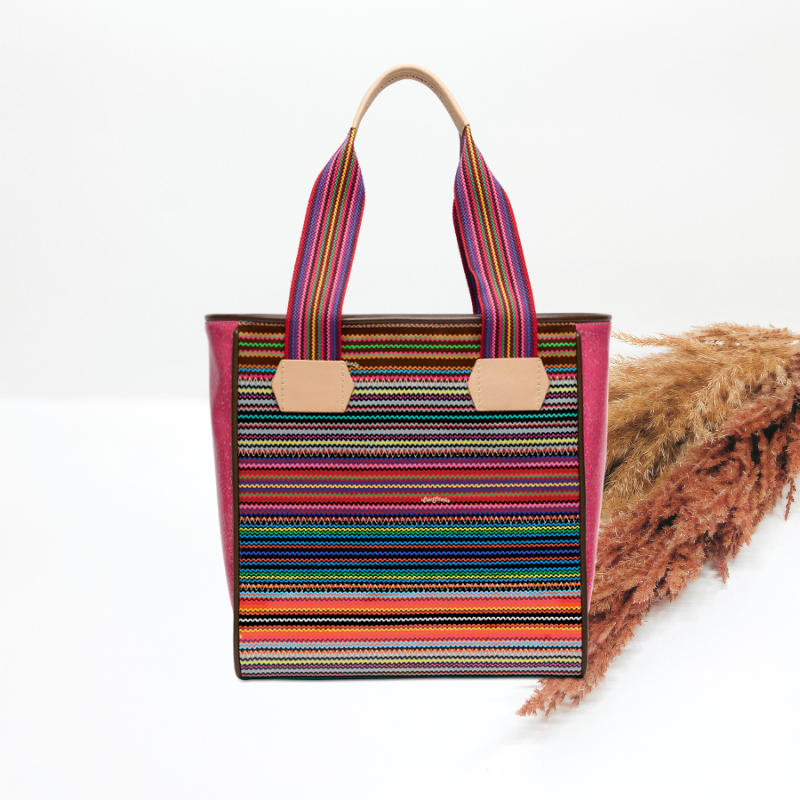 Multicolored striped tote bag with a white background