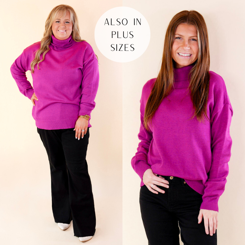 Models are wearing a magenta turtleneck sweater with long sleeves. Models have paired the sweater with black pants, white booties, and gold tone jewelry. 