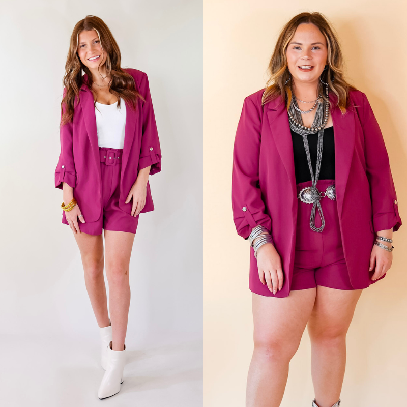 Models are wearing a 3/4 sleeve blazer in magenta. Models have paired the blazer with shorts, booties, and jewelry.