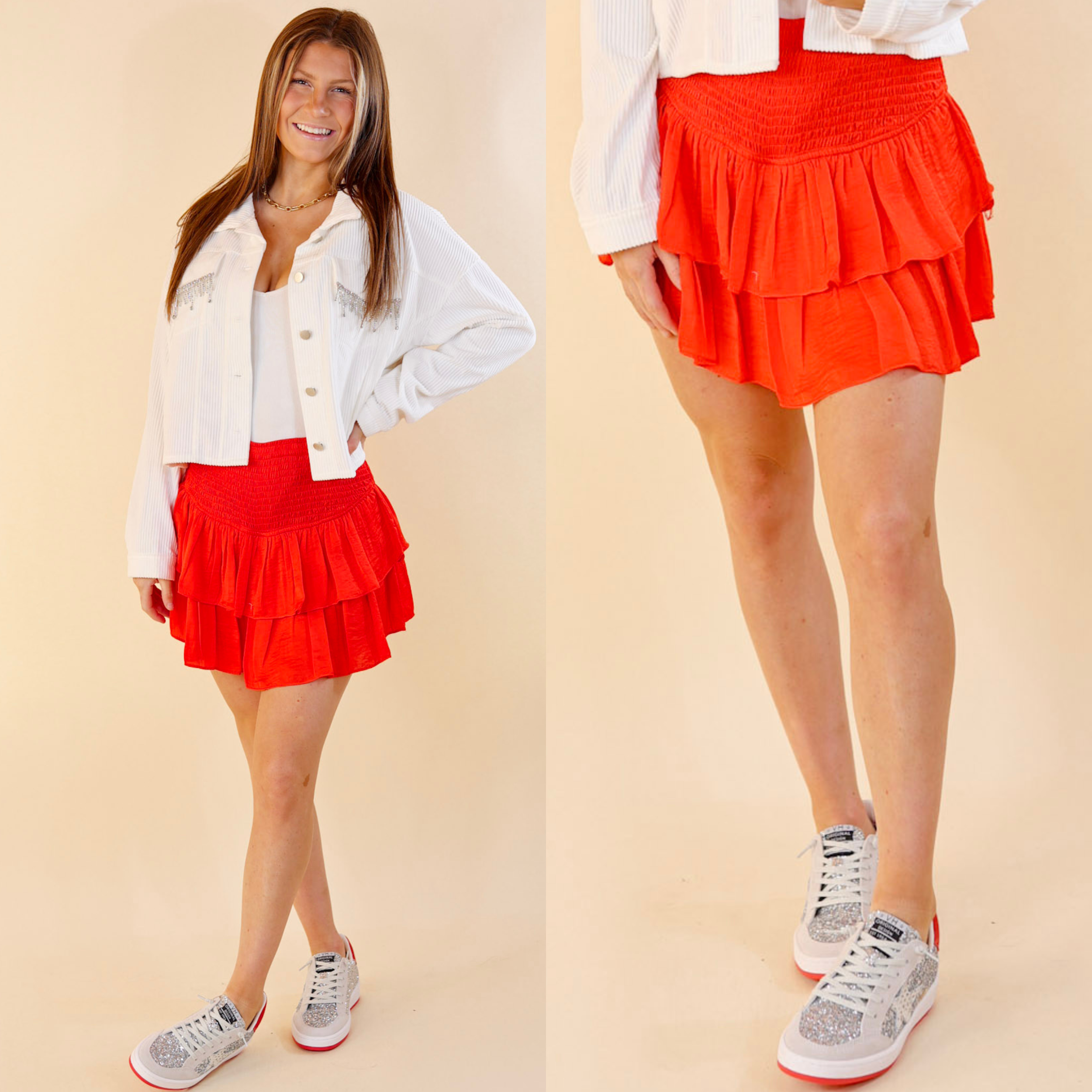in the picture the model is wearing a ruffle red mini skort with a white background