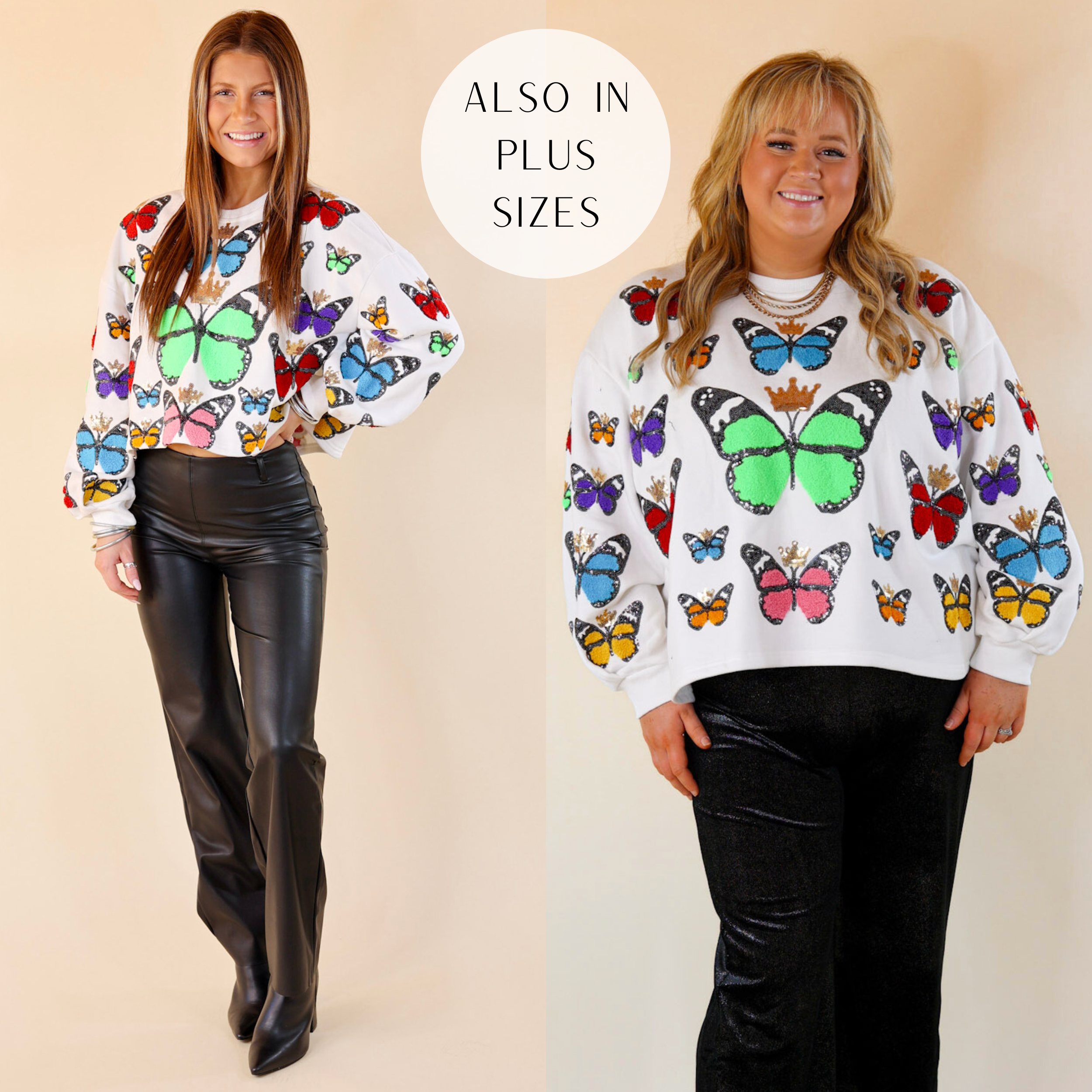 Models are wearing a white long sleeve sweatshirt with multicolored butterflies all over. Size small has it paired with black Lyssé pants black booties, and silver jewelry. Size plus has it paired with black pants and silver jewelry. 