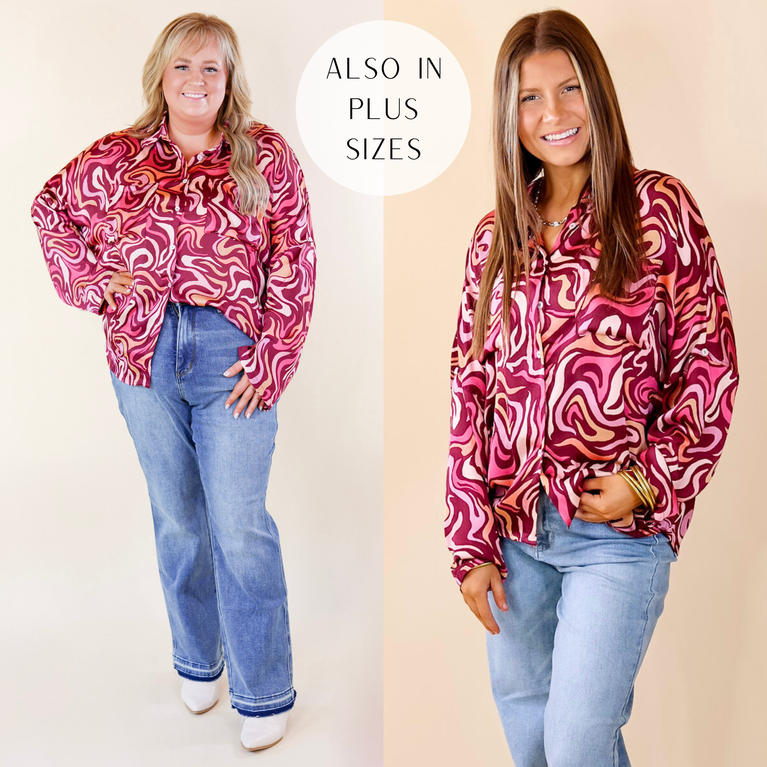Model is wearing a swirl print button up top in magenta purple. Model has paired the top with light wash jeans, silver and white sneakers, and gold tone jewelry.