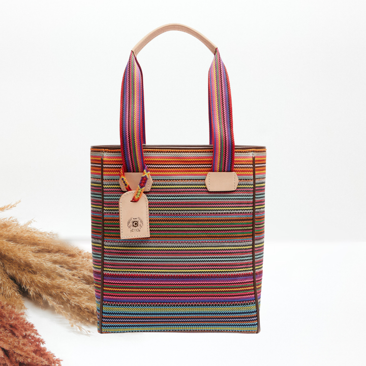 Multicolored striped tote bag with a handle on a white background