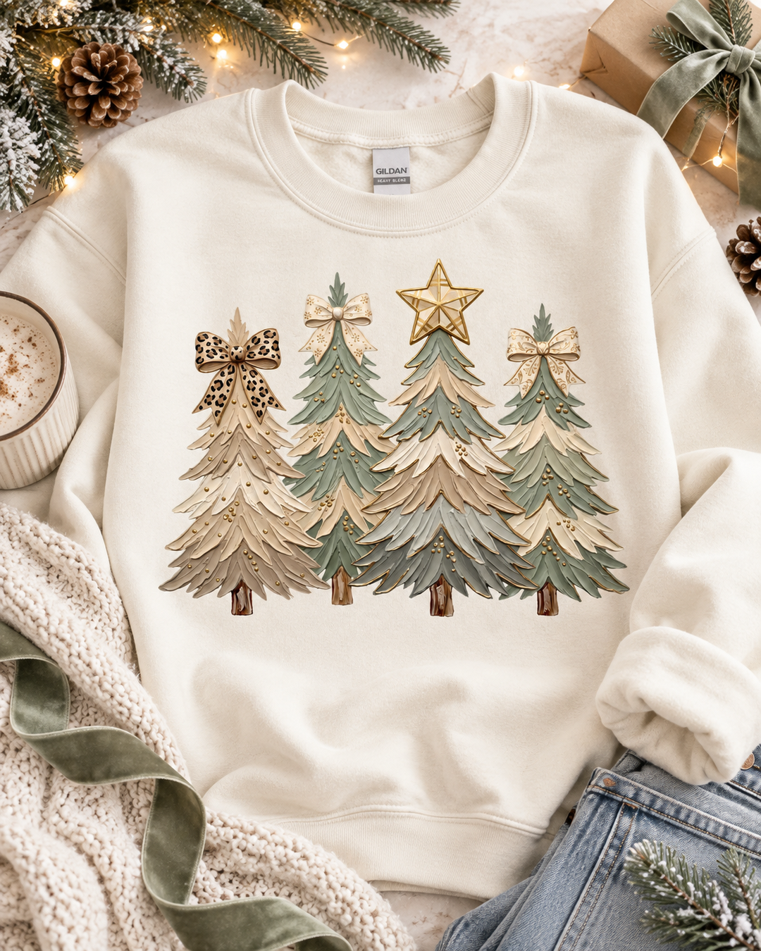 Cozy Trees Christmas graphic tee or sweatshirt on white with four textured Christmas trees in tan, sage and cream with bow and star toppers