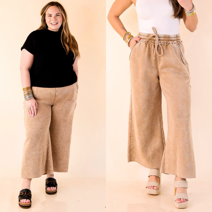 Cropped, cozy, and cool with distressed edges and a comfy drawstring waist—your new go-to sweatpants. Sizes small through large.